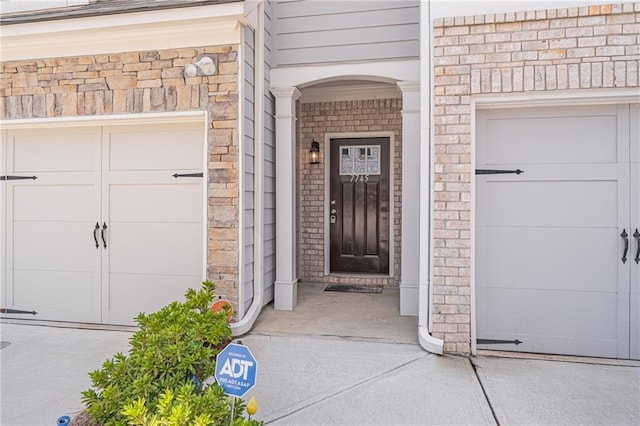 property entrance with a garage