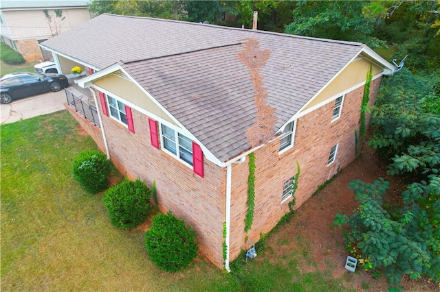 view of home's exterior with a yard