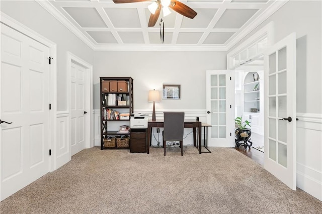 home office featuring carpet floors, wainscoting, french doors, coffered ceiling, and a ceiling fan