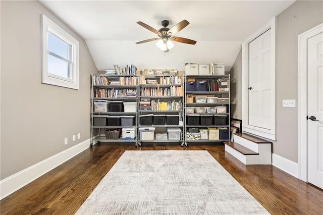 sitting room featuring baseboards, wood finished floors, ceiling fan, and vaulted ceiling