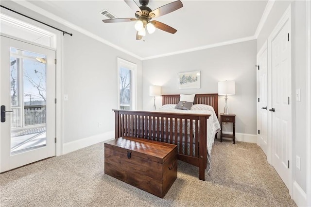 bedroom featuring visible vents, crown molding, and carpet floors