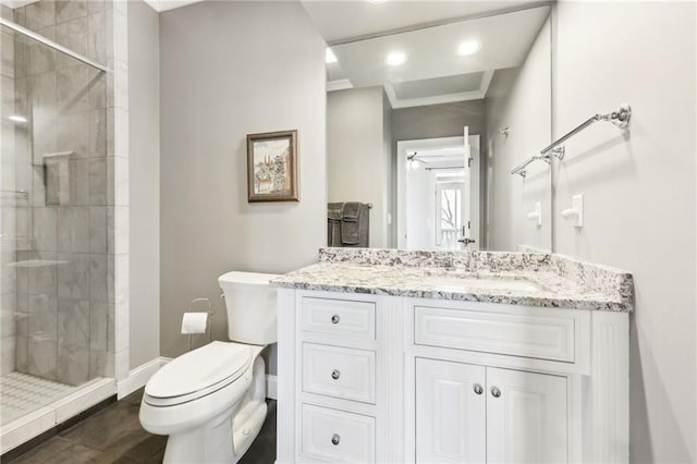 full bathroom with toilet, a stall shower, vanity, and ornamental molding