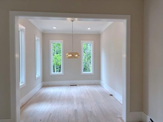 285 White St Unit 4, Marietta, GA 30060 - unfurnished dining area with baseboards, wood finished floors, a chandelier, and crown molding