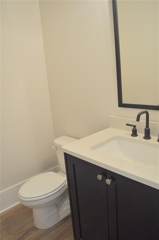 285 White St Unit 4, Marietta, GA 30060 - half bath with vanity, wood finished floors, toilet, and baseboards