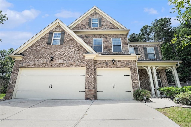 5696 Walnut Mill Ln, Powder Springs, GA 30127 - view of front of home featuring concrete driveway, brick siding, an attached garage, and covered porch