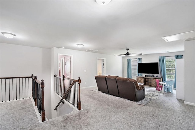 5696 Walnut Mill Ln, Powder Springs, GA 30127 - carpeted living room with attic access and a ceiling fan