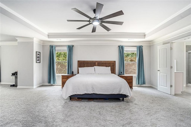 5696 Walnut Mill Ln, Powder Springs, GA 30127 - carpeted bedroom with a tray ceiling, crown molding, ceiling fan, and ensuite bathroom