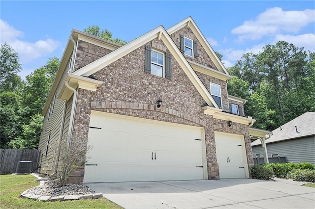 5696 Walnut Mill Ln, Powder Springs, GA 30127 - view of front of house with concrete driveway, stone siding, a garage, and brick siding