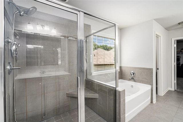 5696 Walnut Mill Ln, Powder Springs, GA 30127 - full bathroom featuring tile patterned floors, a bath, and a stall shower