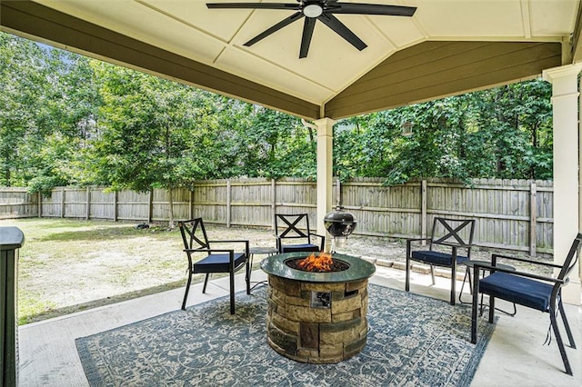 5696 Walnut Mill Ln, Powder Springs, GA 30127 - fenced backyard with a fire pit, a patio area, and a ceiling fan