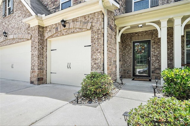 5696 Walnut Mill Ln, Powder Springs, GA 30127 - entrance to property with an attached garage, driveway, a porch, and stone siding