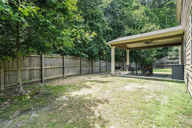 5696 Walnut Mill Ln, Powder Springs, GA 30127 - fenced backyard with a patio area and ceiling fan