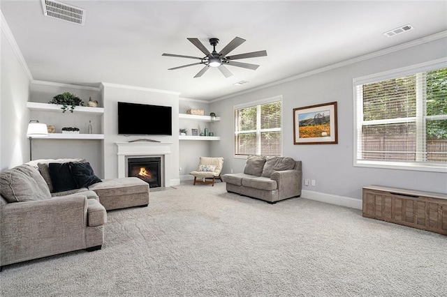 5696 Walnut Mill Ln, Powder Springs, GA 30127 - carpeted living room featuring crown molding, a fireplace with flush hearth, a ceiling fan, and built in features