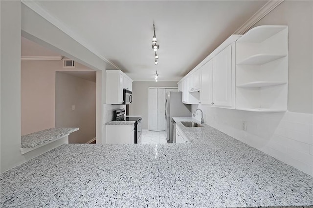 kitchen featuring sink, stainless steel appliances, light stone countertops, white cabinets, and kitchen peninsula