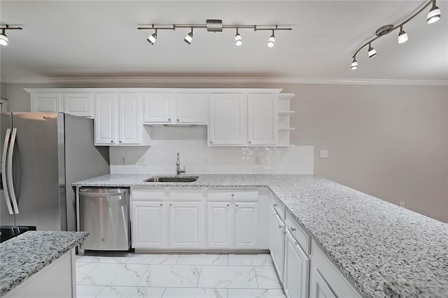 kitchen with white cabinetry, ornamental molding, stainless steel appliances, and sink