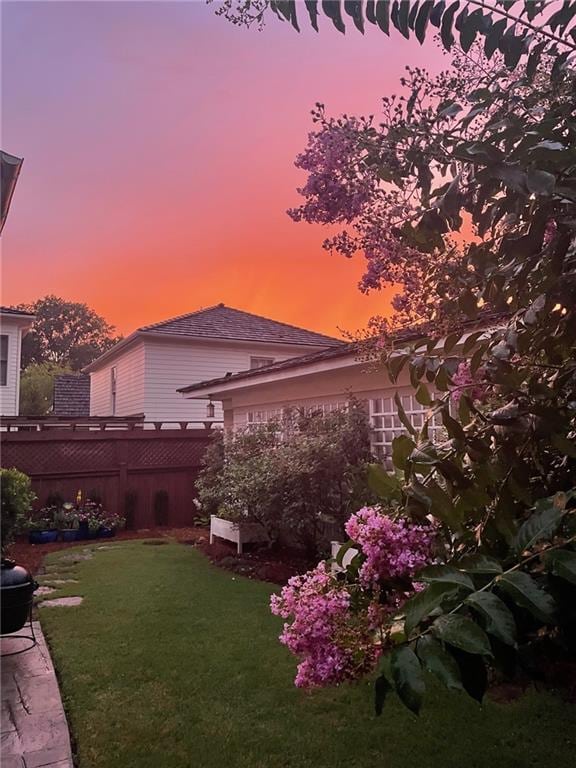 yard at dusk with fence