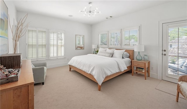 bedroom featuring access to outside, baseboards, a chandelier, and light carpet
