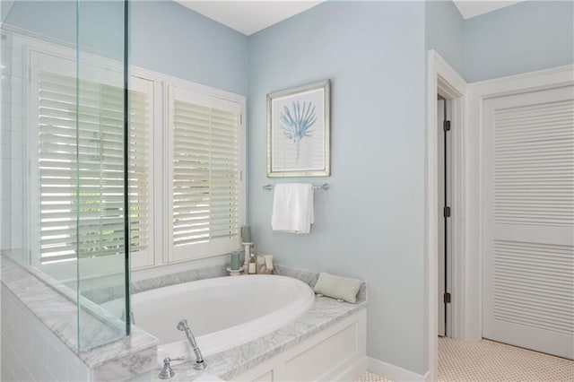 full bath with a garden tub