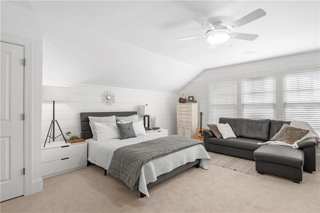 bedroom with carpet floors, ceiling fan, and vaulted ceiling