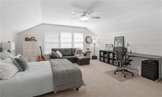 carpeted bedroom with a ceiling fan and vaulted ceiling
