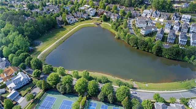 bird's eye view featuring a water view and a residential view