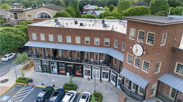 view of property featuring uncovered parking