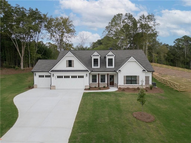 view of front facade with a garage and a front lawn