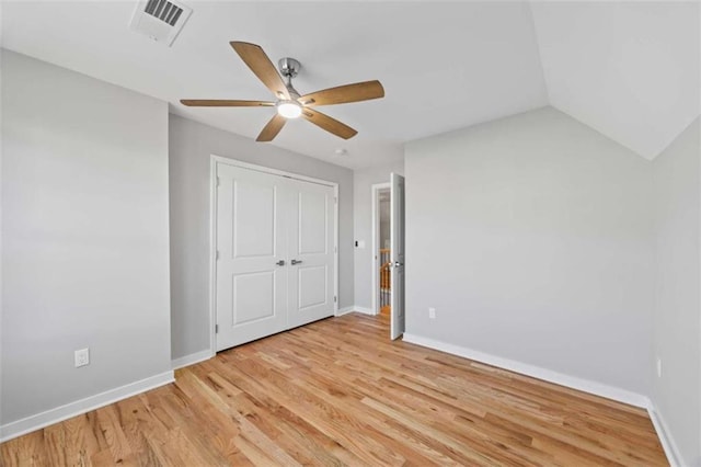 unfurnished bedroom featuring baseboards, visible vents, and light wood finished floors