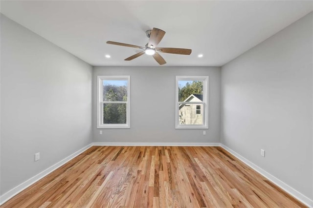 unfurnished room with light wood-style flooring, baseboards, ceiling fan, and recessed lighting