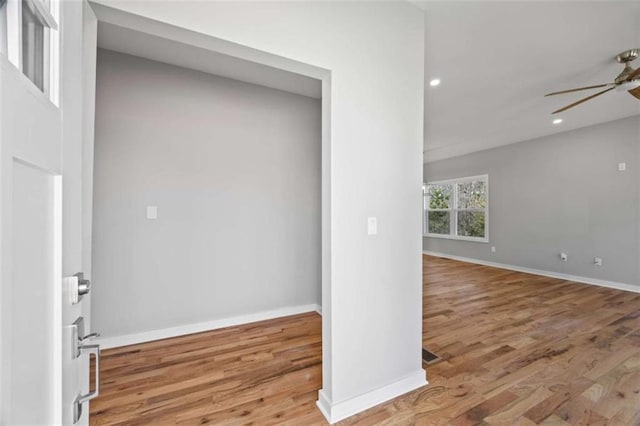 spare room featuring ceiling fan, baseboards, wood finished floors, and recessed lighting