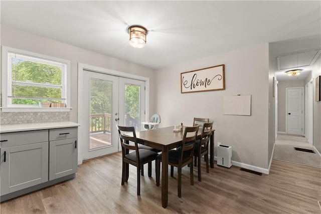 153 Garrison Dr, Cleveland, GA 30528 - dining space featuring attic access, light wood finished floors, french doors, and baseboards