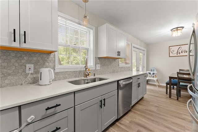 153 Garrison Dr, Cleveland, GA 30528 - kitchen featuring a sink, appliances with stainless steel finishes, plenty of natural light, and light wood-style flooring