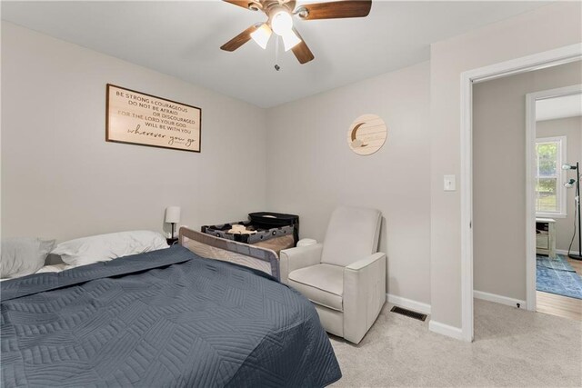 153 Garrison Dr, Cleveland, GA 30528 - bedroom with baseboards, light colored carpet, and a ceiling fan