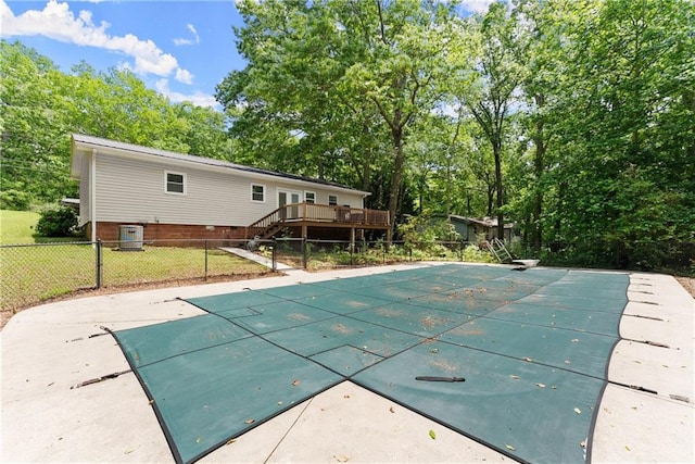153 Garrison Dr, Cleveland, GA 30528 - view of swimming pool with cooling unit, a wooden deck, a diving board, and view of wooded area