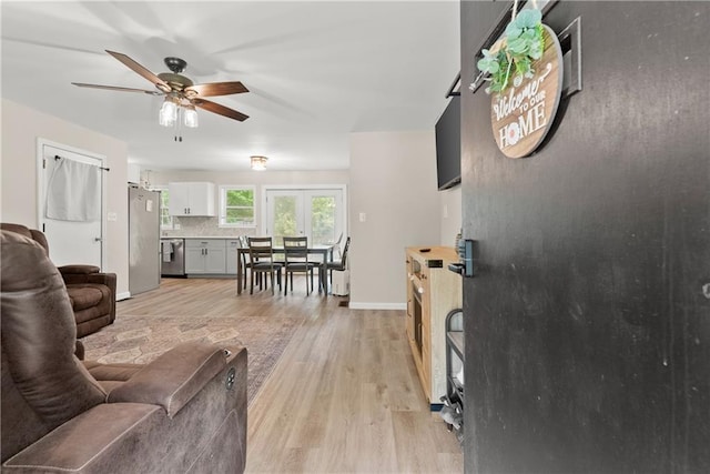 153 Garrison Dr, Cleveland, GA 30528 - living area with ceiling fan, light wood-type flooring, and baseboards