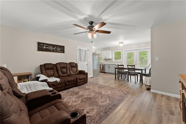 153 Garrison Dr, Cleveland, GA 30528 - living room with ceiling fan, light wood finished floors, and baseboards