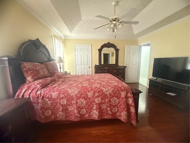 3484 Lynley Mill Ln, Dacula, GA 30019 - bedroom with a tray ceiling, wood finished floors, ornamental molding, and ceiling fan