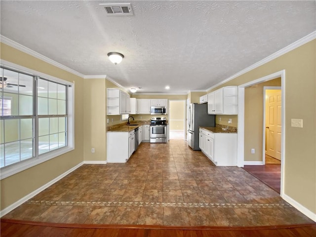 kitchen with open shelves, stainless steel appliances, visible vents, ornamental molding, and a sink