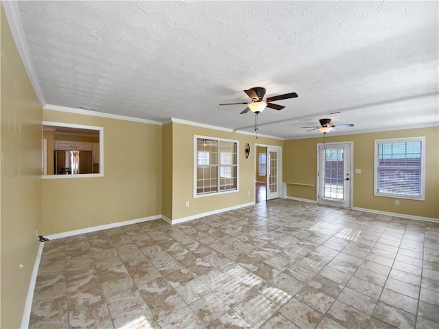 unfurnished room with ornamental molding and baseboards