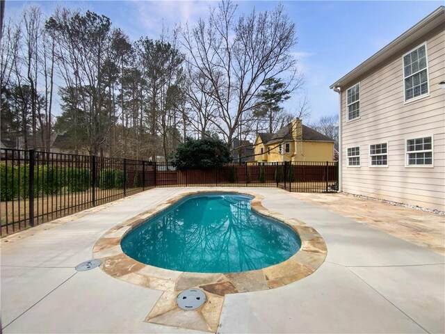view of pool featuring a patio area, a fenced backyard, and a fenced in pool