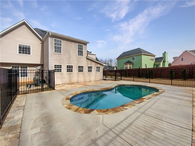 view of swimming pool featuring a patio area, a fenced backyard, and a fenced in pool