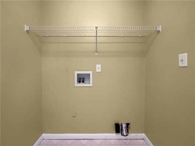 washroom with baseboards, laundry area, hookup for a washing machine, and hookup for an electric dryer