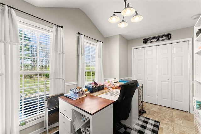 office featuring stone finish flooring and lofted ceiling