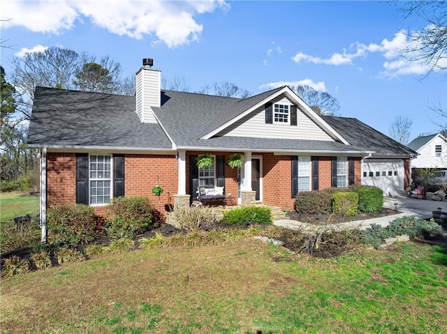 view of front of property featuring a front yard, roof with shingles, a chimney, a garage, and brick siding