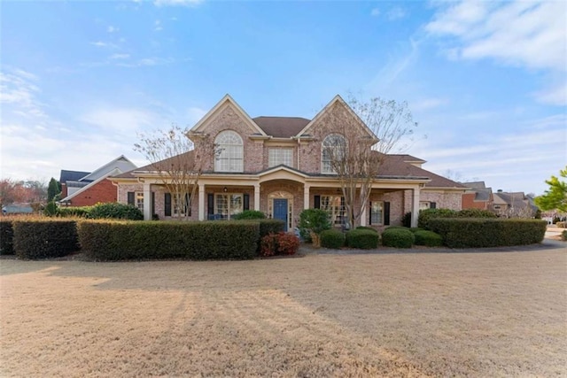 view of front of home featuring brick siding