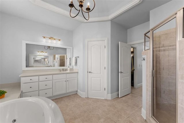 bathroom with a stall shower, a raised ceiling, crown molding, vanity, and a notable chandelier