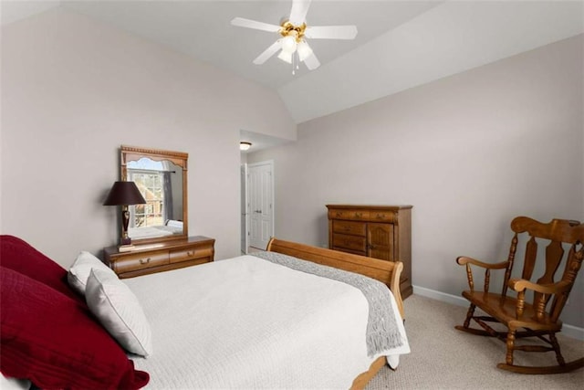 carpeted bedroom with ceiling fan, baseboards, and vaulted ceiling