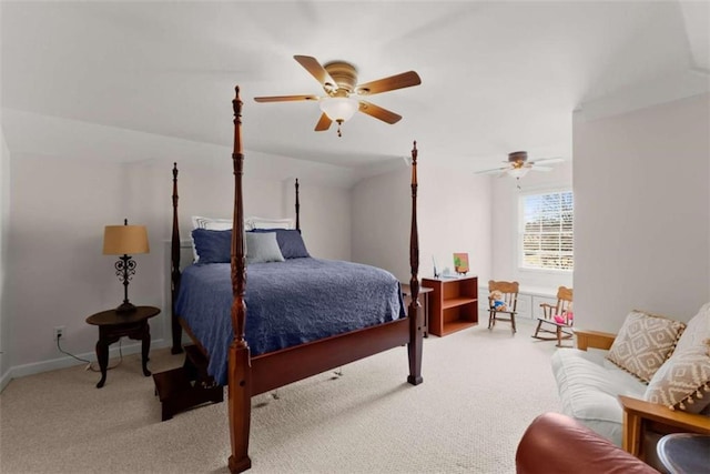 bedroom featuring ceiling fan, baseboards, and light colored carpet