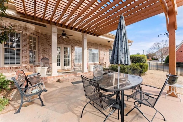 view of patio / terrace with ceiling fan, fence, a pergola, and outdoor dining space