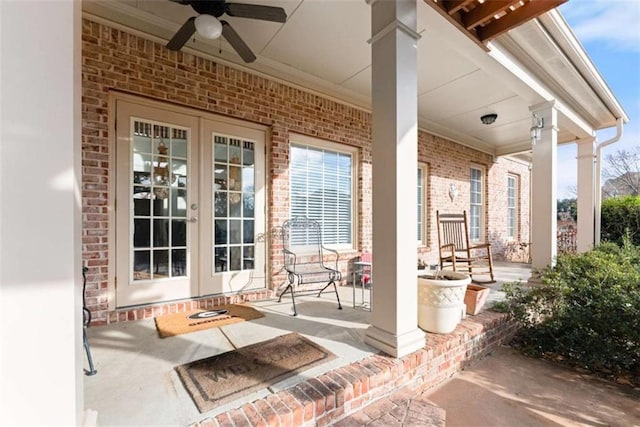 view of patio featuring covered porch, ceiling fan, and french doors